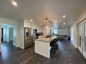 Entryway/front door to the left and access to back patio on the right. 