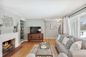 TV, fireplace, books, offices