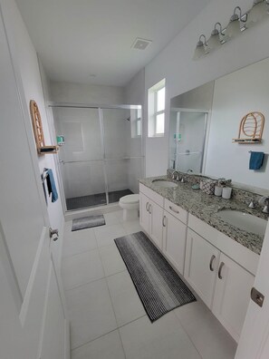 Shower, hair dryer, towels, soap