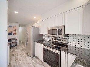 Blender, cookware/dishes/utensils, ice maker, dining tables