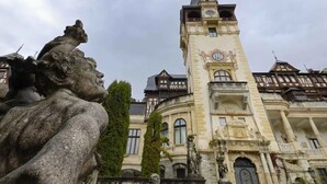 A historic building with a prominent clock tower and classical architecture. - Studio 4 - 5 Strada Scărlătescu (București)