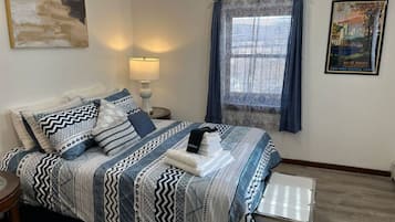 1 bedroom, desk, iron/ironing board, travel cot