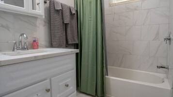 Hair dryer, towels, soap, shampoo