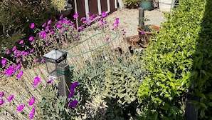 A two-story house with a porch and a small shed. -  Eastside Costa Mesa, close to Disneyland, beaches.
1.5 miles to JWA airport. (Costa Mesa)