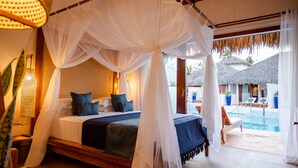 A bedroom with a four-poster bed, a view of the pool, and a thatched-roof structure outside. - MKNI Hotel - Makani Experience (Acaraú)