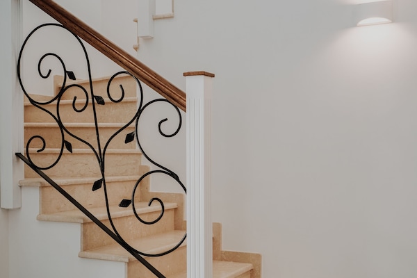 Magnificent marble staircase complemented by exquisite wrought iron work.