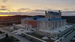 A large, castle-like building with multiple towers and a central courtyard. - 2 bed 2 bath apartment in Castle (Grandville)