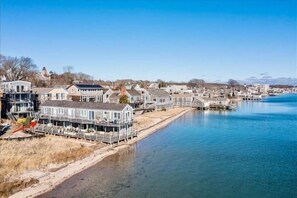 A coastal town with waterfront properties and a clear view of the water.