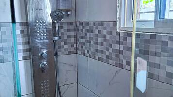 Shower, hair dryer, towels, soap
