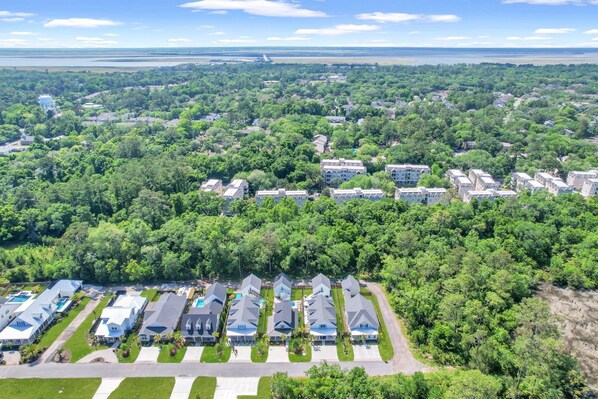 A residential area with multiple houses and a water tower.