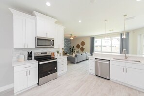 Fridge, microwave, oven, stovetop - Luxury Coastal Home - Steps to Beach w/Private Backyard, Hot Tub & Games Room! (Cape Canaveral)