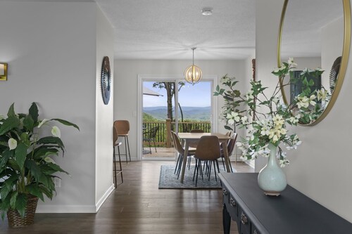 Great sunset view, hot tub, game room, big fire pit and new large fenced yard!