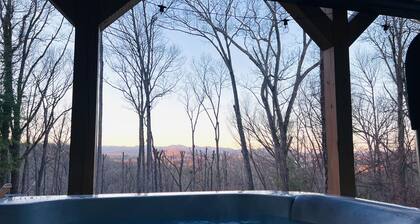 Great sunset view, hot tub, game room, big fire pit and new large fenced yard!