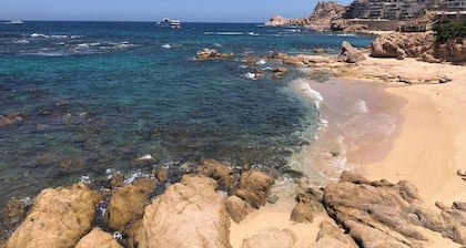 Large house on a hill with a spectacular view over the sea and mountains