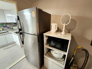 Fridge, microwave, cookware/dishes/utensils, spices