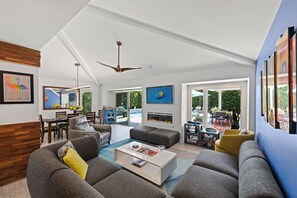 Smart TV, fireplace, books, printers