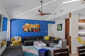 Smart TV, fireplace, books, printers