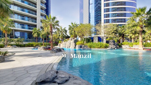 Outdoor pool - Manzil - Cozy 1BR in Paramount w Burj Khalifa View (Dubai)