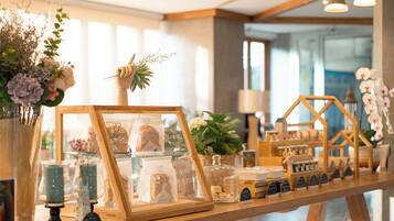 A bakery display with pastries and a wooden counter.
