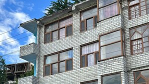 A multi-story building with a sign for 'Hotel Beas Valley'. - Hotel Beas Valley (Manali)