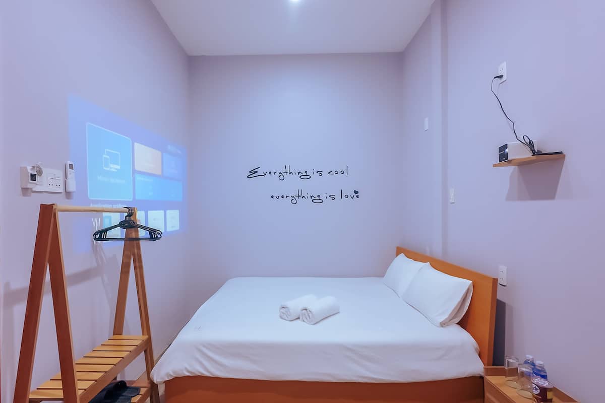 Habitación doble superior | Minibar y ropa de cama