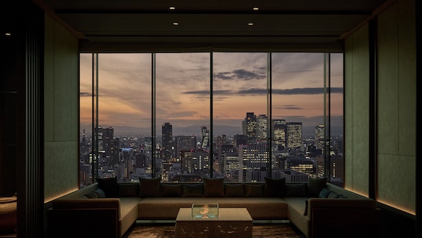 A modern living room with a large window offering a cityscape view. - The Royal Park Hotel Iconic Nagoya (Nagoya)