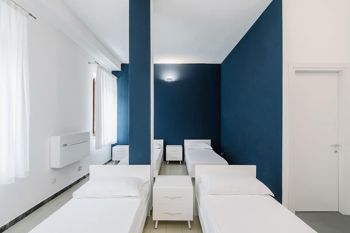 Habitación cuádruple básica | Cuna de viaje y wifi gratis