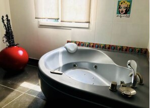 Jetted bath, hair dryer, towels, soap