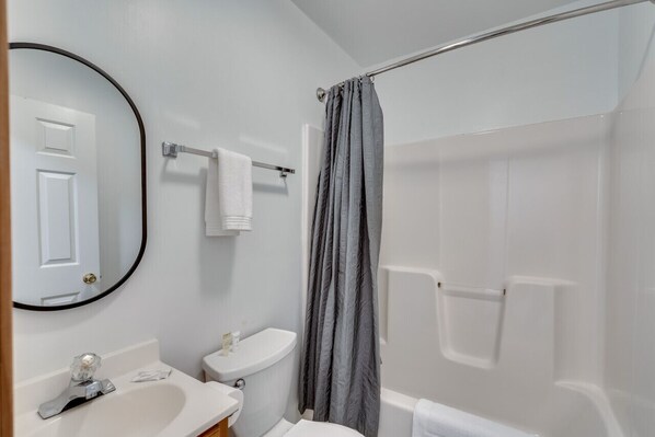 A bathroom with a toilet, sink, and shower. - K's Motel with Stunning St. Lawrence River Views - Room 8 (Clayton)