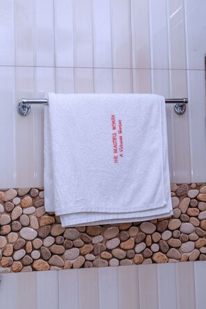 Shower, towels, soap, toilet paper