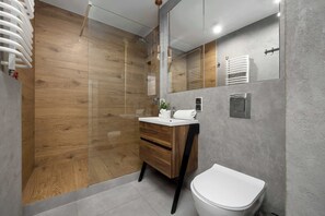 Shower, hair dryer, towels, shampoo