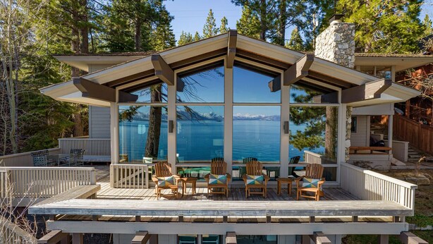 A modern house with a large deck, outdoor seating, and a view of a lake. - Sapphire Lakefront in Dollar Point, 3BR + 1BR Guest Unit, with Buoy! (Tahoe City)