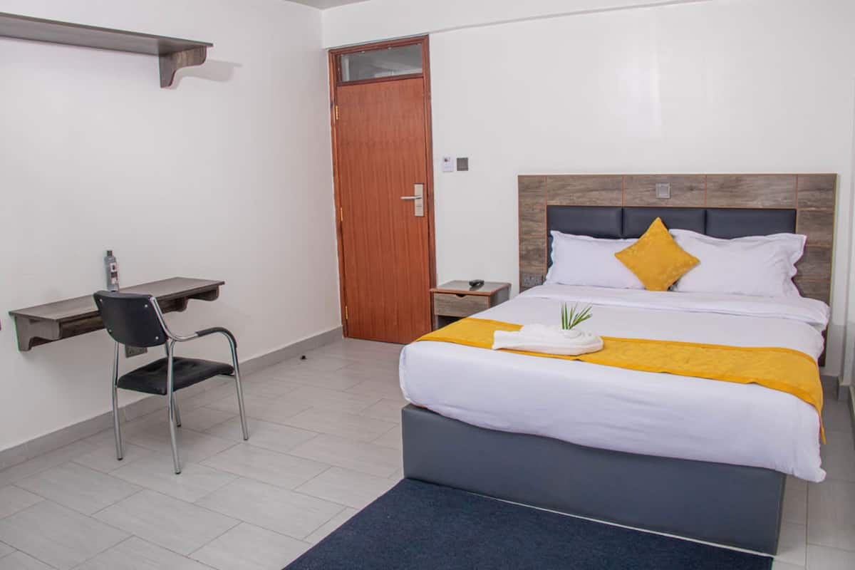 Desk, laptop workspace, free WiFi, bed sheets