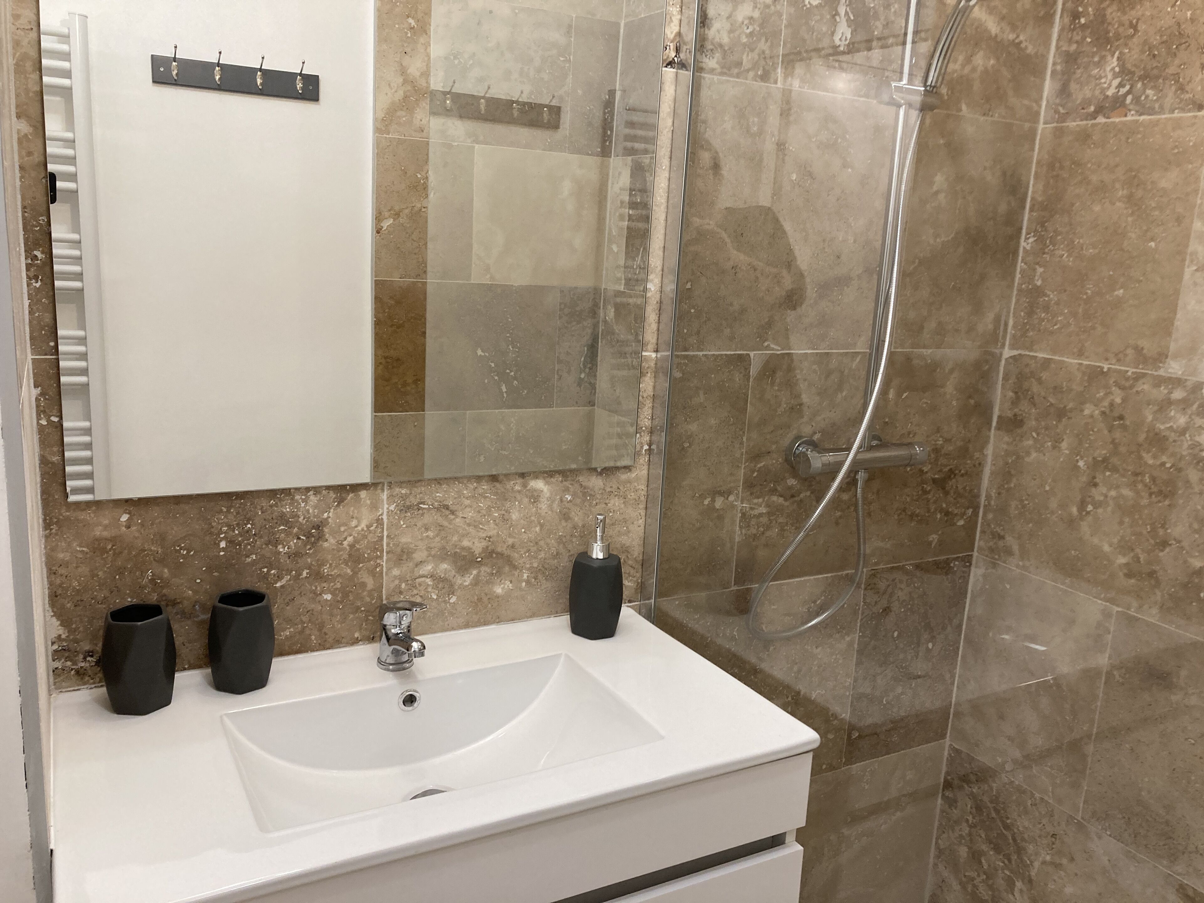 Shower, hair dryer, towels, toilet paper