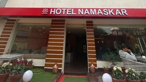 A hotel named "HOTEL NAMASKAR" with a modern facade, multiple windows, and a red entrance. - Hotel Namaskar (Kathmandu)