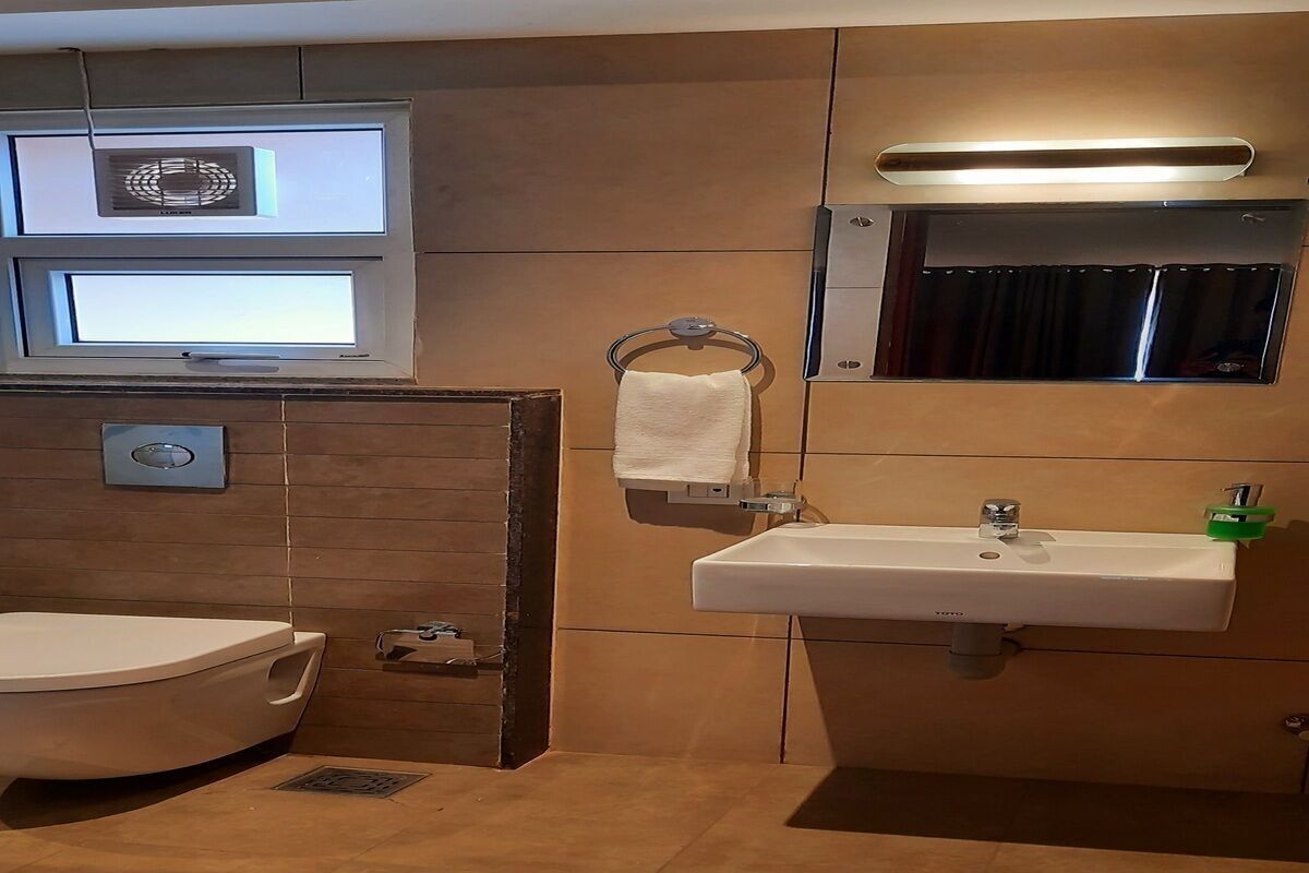 Bathroom | Shower, rainfall showerhead, designer toiletries, hair dryer