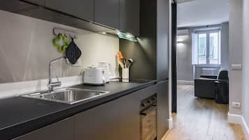 Comfort Apartment | Private kitchen | Full-size fridge, microwave, oven, stovetop