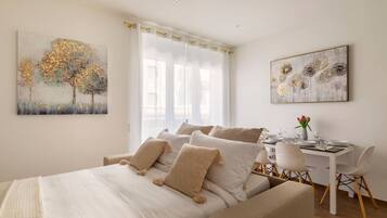 1 bedroom, desk, iron/ironing board, travel crib