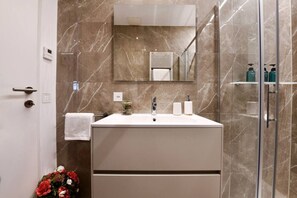 Hair dryer, towels, soap, shampoo