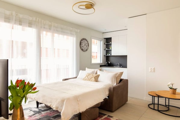1 bedroom, desk, iron/ironing board, travel crib