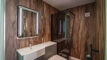 Shower, hair dryer, towels