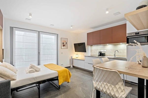 A modern kitchen to inspire your culinary creativity, complete with cozy dining space.