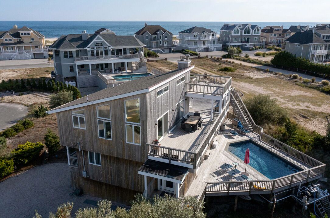 Beach access. Amazing bay view. Heated pool. Huge decks. Cul de sac Pickleball!