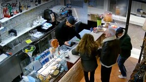 A kitchen area with a counter, various kitchen appliances, and a display case with food items. -  All Inclusive Deluxe Penthouse Studio (Sestri Levante)