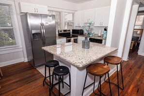 Fridge, coffee/tea maker, cookware/dishes/utensils