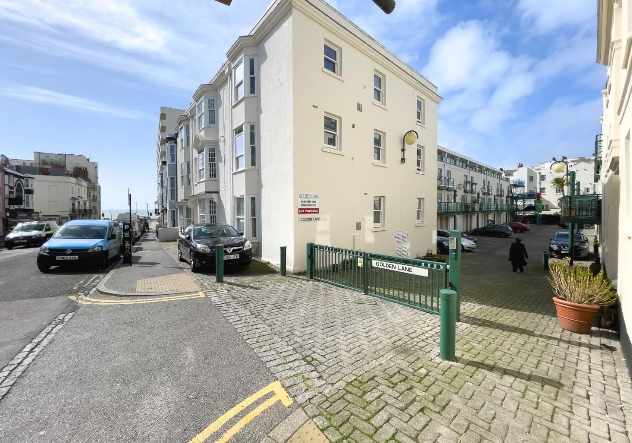 A street view with a building labeled "GOLDEN LANE" and a pedestrian crossing.