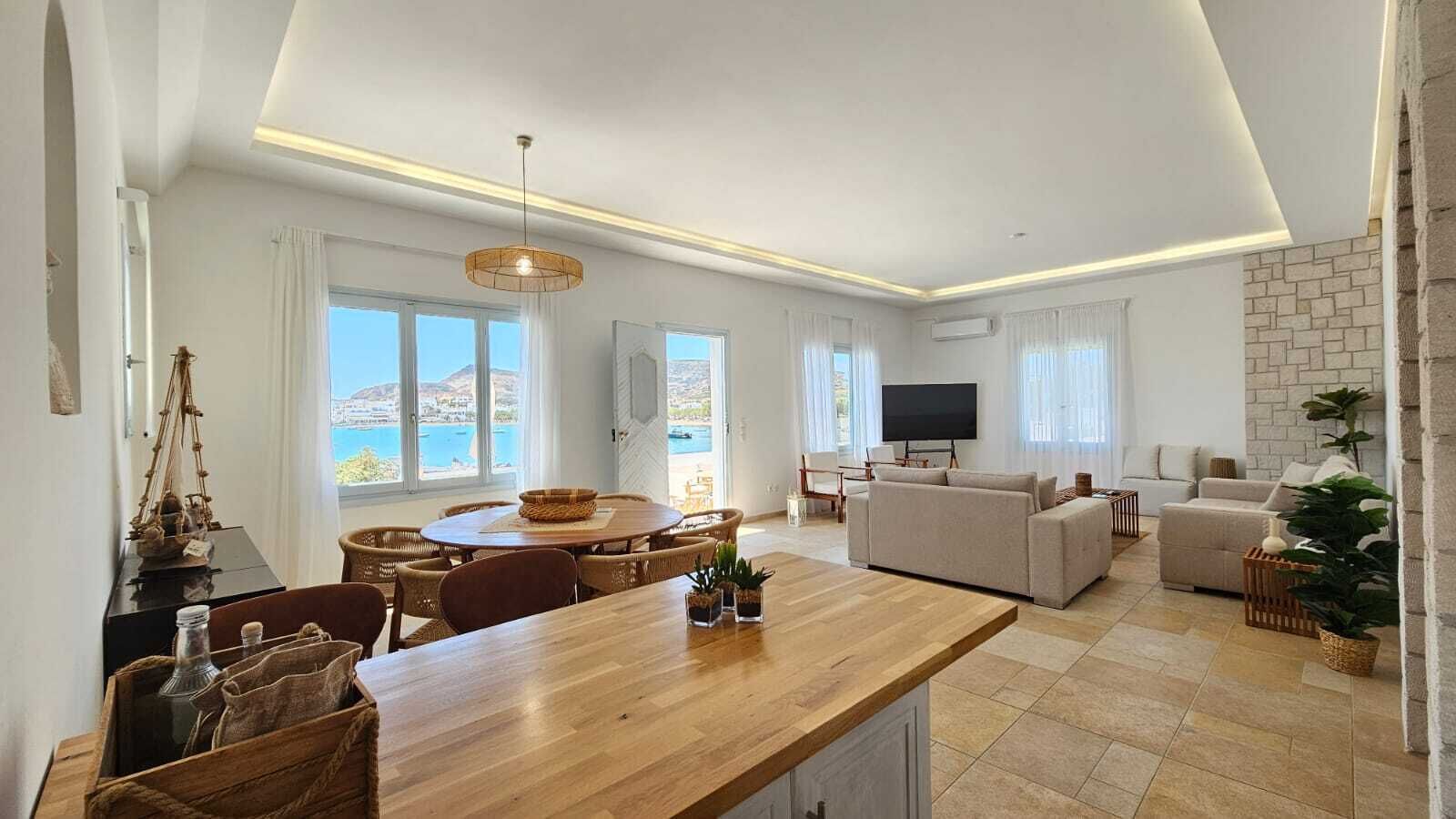 Premium Apartment, Sea View | Living area | 65-inch LED TV with digital channels