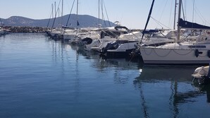 A marina with several sailboats docked.