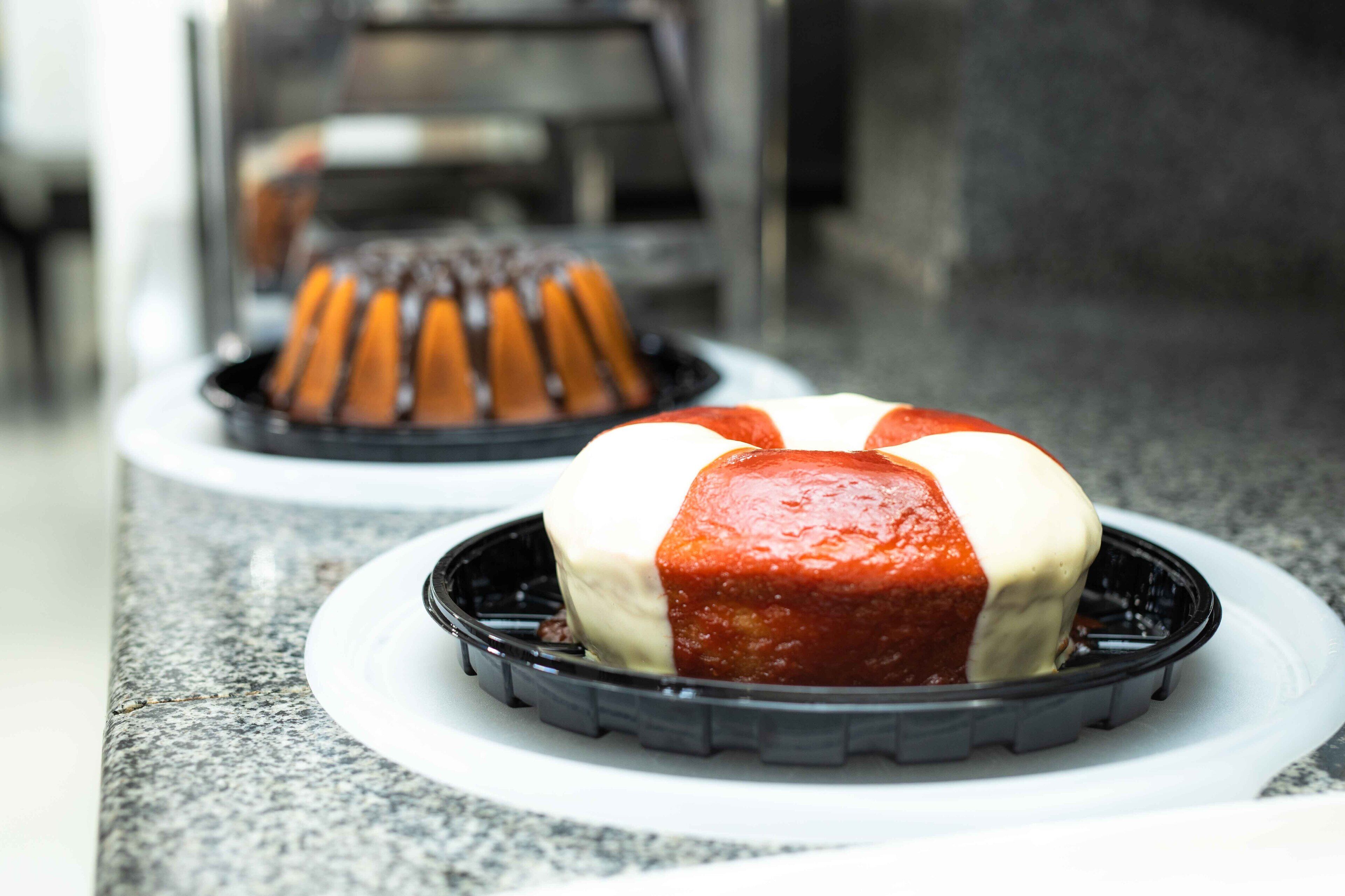 A dessert with a red and white topping on a plate.
