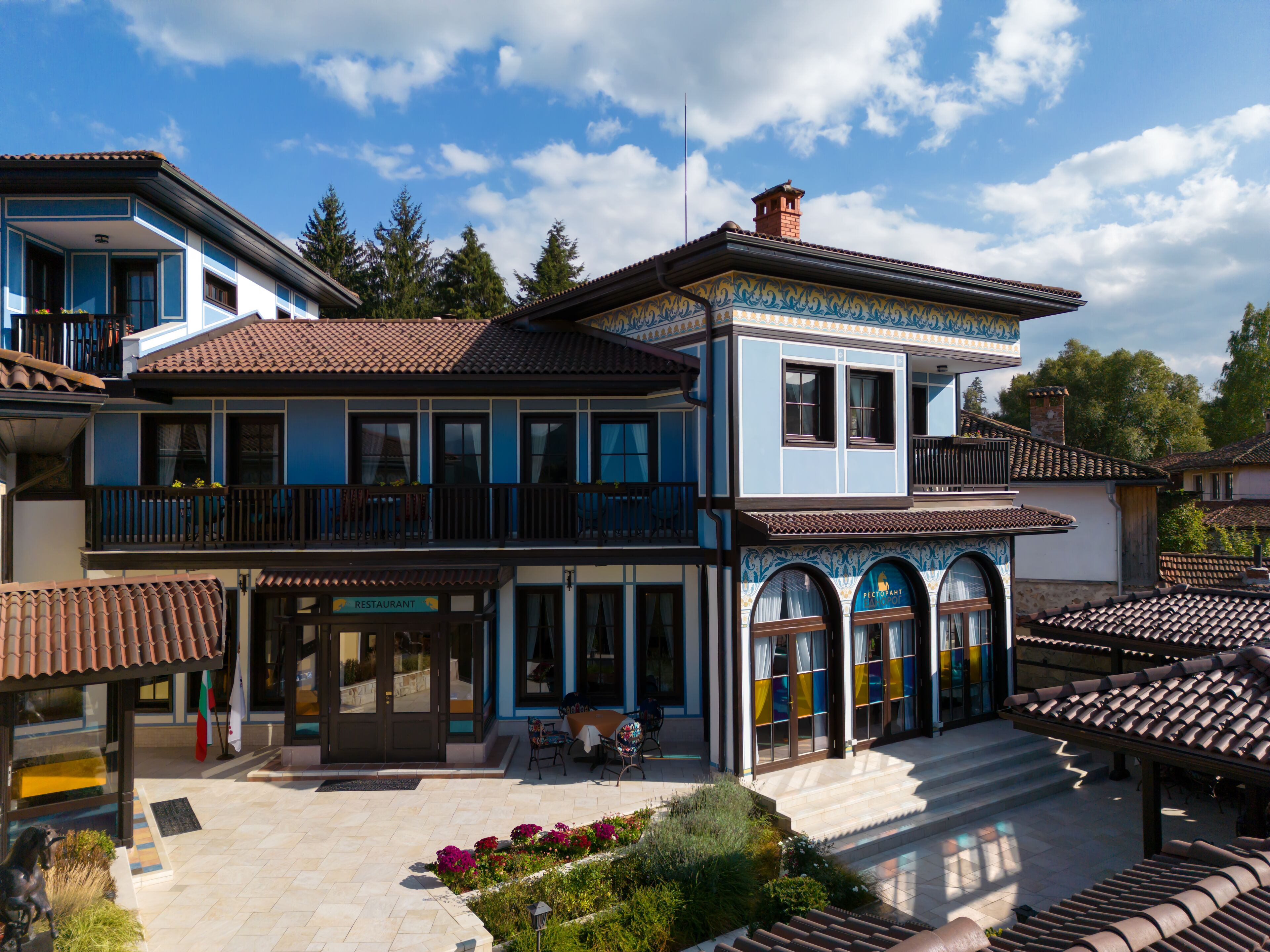 A two-story building with a restaurant on the ground floor and a restaurant on the upper floor.